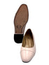 Light pink shoe with brown insole on a white background