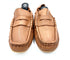 Pair of tan loafers on a white background