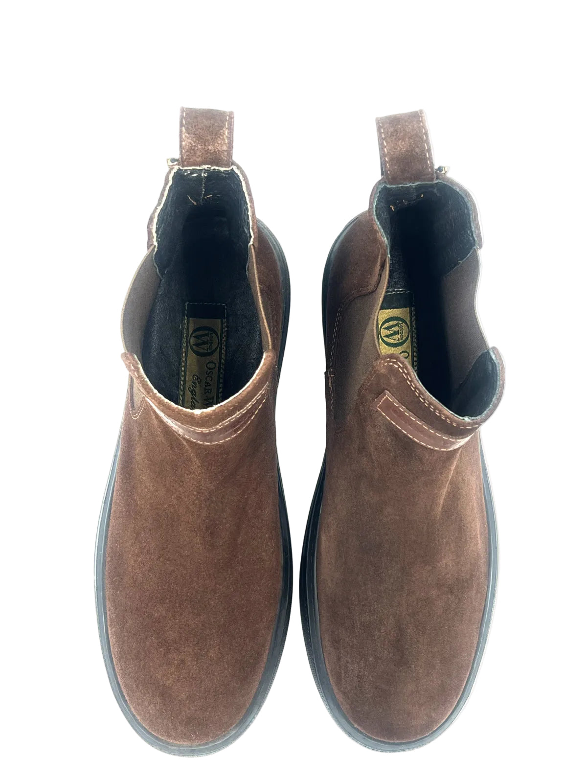 Pair of brown suede boots on a white background